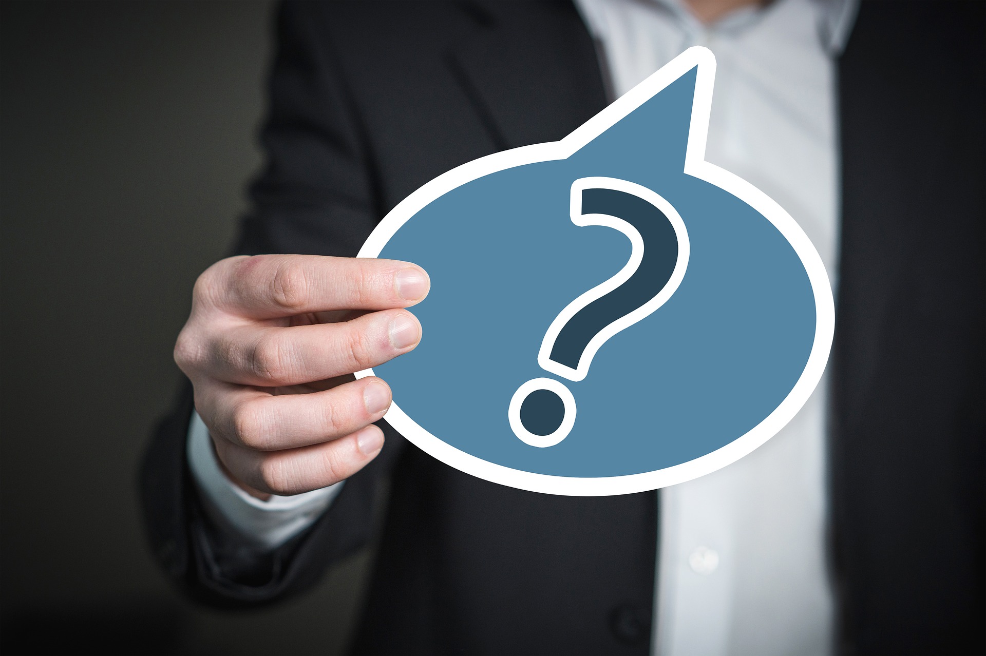 man holding a question mark